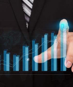 Business man pressing high tech type of modern graph on a virtual background