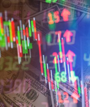 Double exposure of stock market in tablet with money and chart.