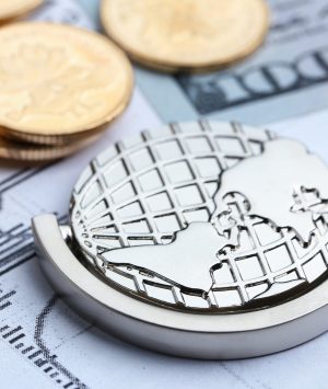 Coins, paper money and globe on white Statistic form background