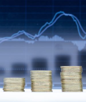 A stack of five rows of coins with graph dark blue background.